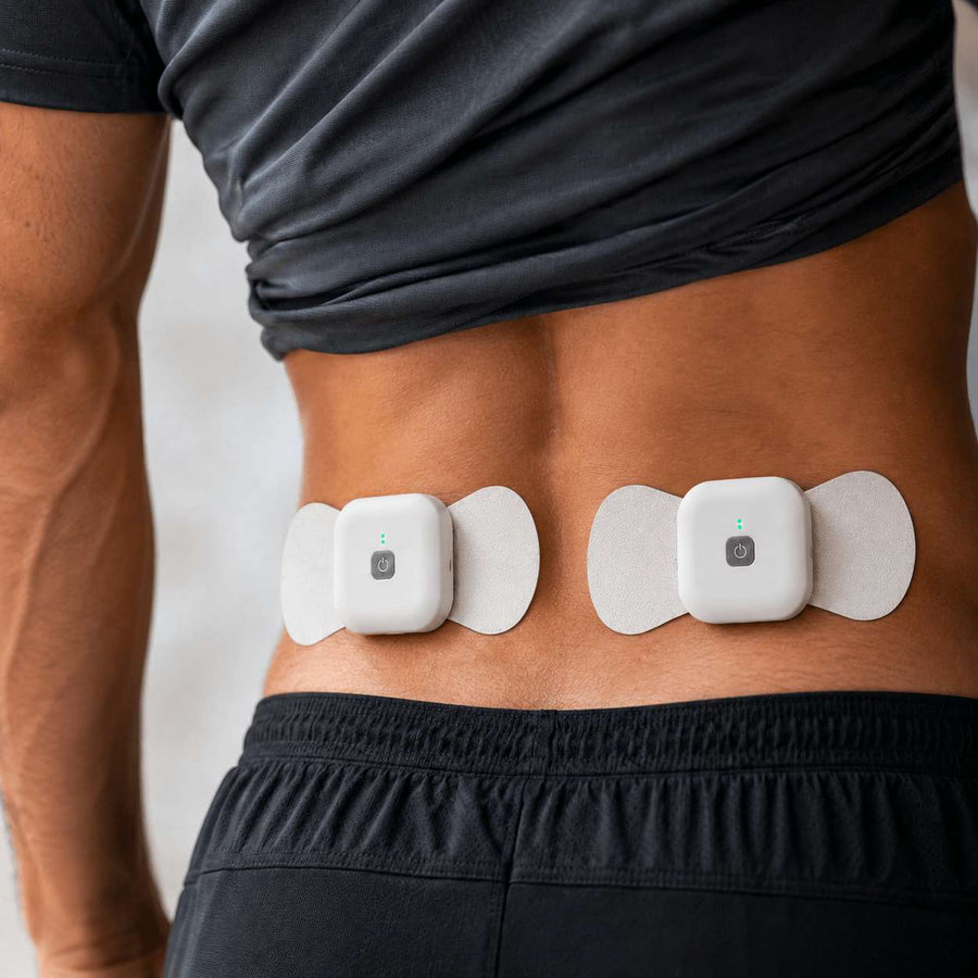 Électrostimulateur TENS sans fil 4 canaux utilisé sur le bas du dos